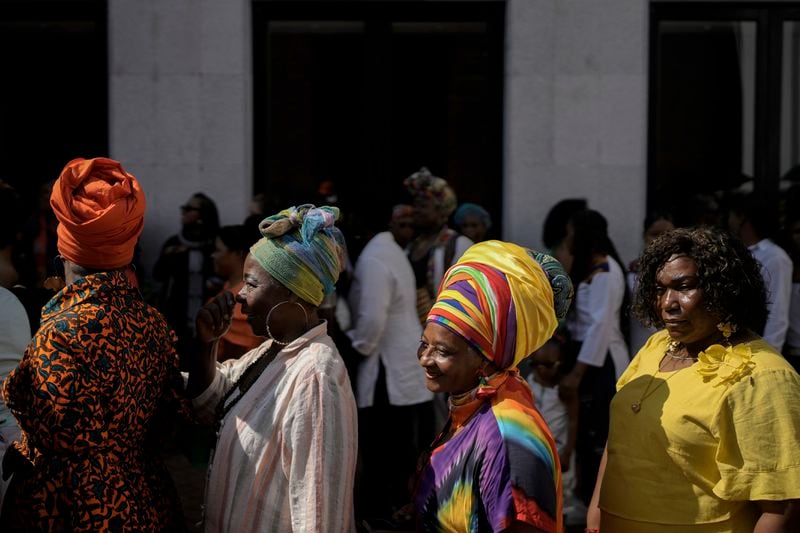 Women line up to attend a forum on Afro women and power with Prince Harry and his wife Meghan in Cali, Colombia, Sunday, Aug. 18, 2024. (AP Photo/Ivan Valencia)