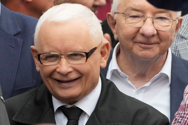 Leader of Poland's right-wing opposition party Law and Justice, Jaroslaw Kaczynski, left, attends the party's protest rally of a few thousand backers against the policies of Prime Minister Donald Tusk's Cabinet, before the Ministry of Justice, in Warsaw, Poland, Saturday Sept. 14, 2024. (AP Photo/Czarek Sokolowski)