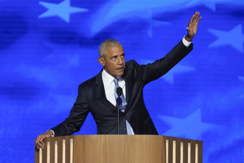 Former President Barack Obama gestures as he finishes speaking at the Democratic National Convention on Tuesday, Aug. 20, 2024, in Chicago. (AP Photo/J. Scott Applewhite)