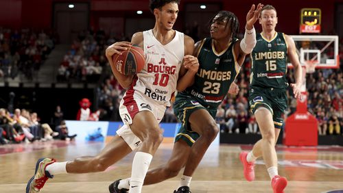 Zaccharie Risacher, of Bourg-en-Bresse, dribbles during a Betclic Elite basketball game against Limoges in Bourg-en-Bresse, eastern France, on Oct. 31, 2023. Risacher could be the top pick in the June 26, NBA draft. (AP Photo)