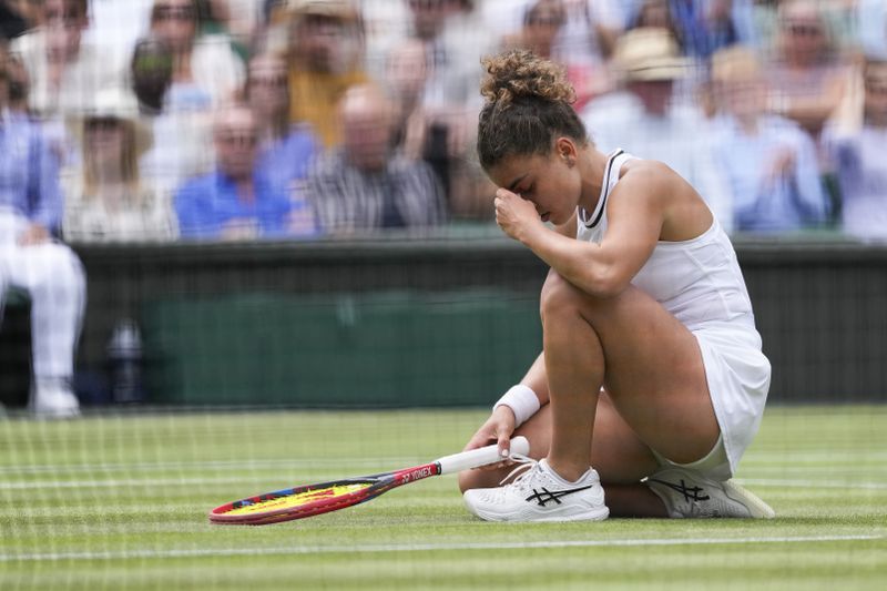 Jasmine Paolini of Italy reacts during her semifinal match against Donna Vekic of Croatia at the Wimbledon tennis championships in London, Thursday, July 11, 2024. (AP Photo/Alberto Pezzali)