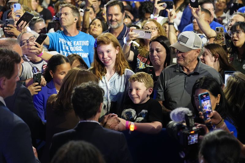 Democratic presidential nominee Vice President Kamala Harris, second from left, greets people in the crowd after speaking at a rally on Sunday, Sept. 29, 2024, in Las Vegas. (AP Photo/Carolyn Kaster)