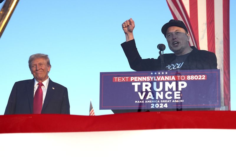 Tesla and SpaceX CEO Elon Musk speaks as Republican presidential nominee former President Donald Trump listens at a campaign event at the Butler Farm Show, Saturday, Oct. 5, 2024, in Butler, Pa. (AP Photo/Alex Brandon)