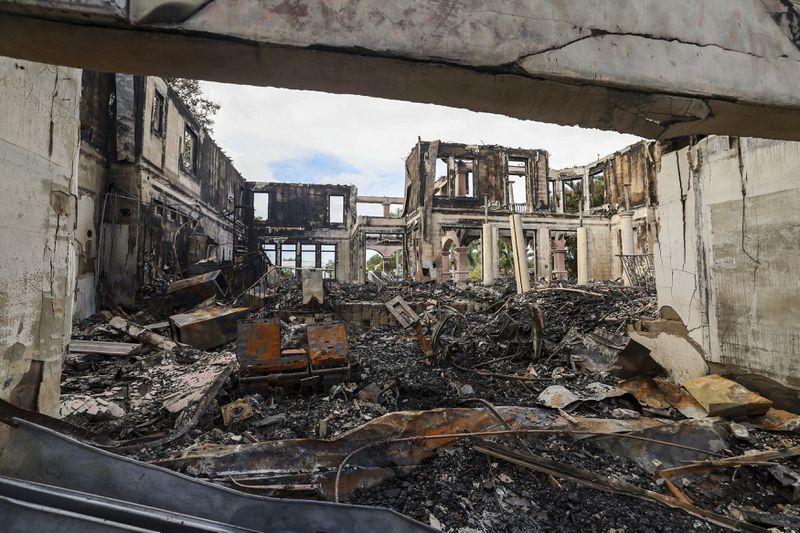 The remains of a home on Davis Island that burned during Hurricane Helene on Saturday, Sept. 28, 2024, in Tampa, Fla. (AP Photo/Mike Carlson)