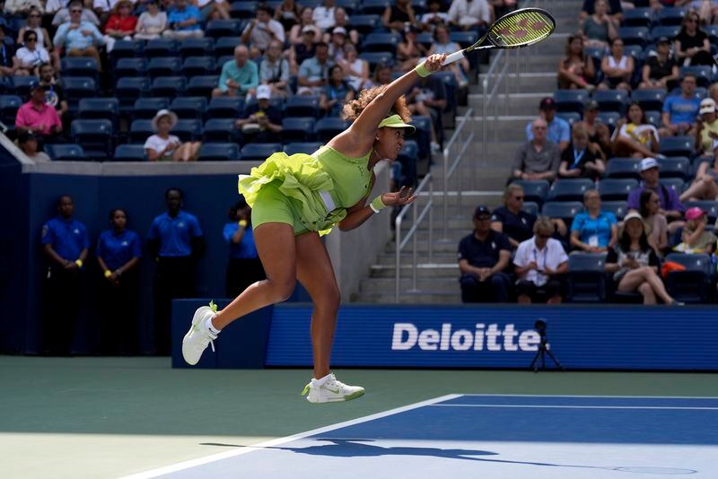 Naomi Osaka, of Japan, serves to Jelena Ostapenko, of Latvia, during the first round of the U.S. Open tennis championships, Tuesday, Aug. 27, 2024, in New York. (AP Photo/Seth Wenig)