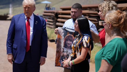 Republican presidential nominee former President Donald Trump speaks during a tour of the southern border with Mexico, Thursday, Aug. 22, 2024, in Sierra Vista, Ariz, as Alexis Nungaray, mother of Jocelyn, listens and Joamel holds a shirt with a photo of Jocelyn. (AP Photo/Evan Vucci)