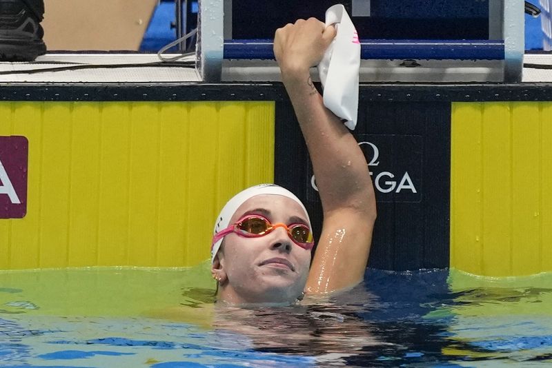 Regan Smith smiles after a Women's 100 backstroke preliminary heat Monday, June 17, 2024, at the US Swimming Olympic Trials in Indianapolis. (AP Photo/Michael Conroy)