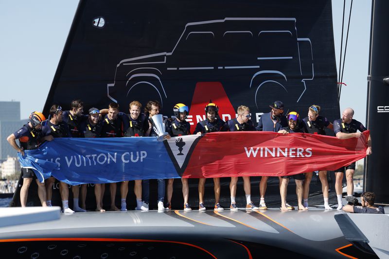 INEOS Britannia crew celebrate their victory against the Luna Rosa Prada Pirelli's sailing team during the Louis Vuitton Cup Final Day 7 at the Barcelona's coast, Spain, Friday, Oct. 4, 2024. (AP Photo/Joan Monfort)