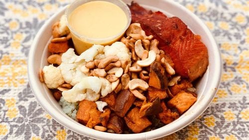This build-it-yourself bowl from Upbeet features steelhead trout, bamboo rice, cauliflower, green lentils, roasted chickpeas, sweet potatoes, cashews, pickled onions and curry coconut dressing. CONTRIBUTED BY WENDELL BROCK