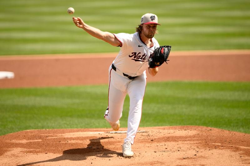 Washington Nationals starting pitcher Jake Irvin throws during the first inning of a baseball game against the New York Mets, Thursday, July 4, 2024, in Washington. (AP Photo/Nick Wass)
