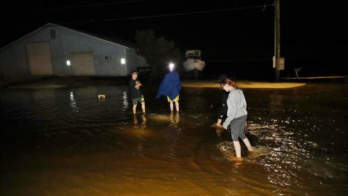 093022 St. Mary’s: Local residents check minor flooding at Lang's Marina from Hurricane Ian on St, Mary’s Street in historic downtown St. Mary’s while the storm passes by heading toward South Carolina in the early hours of Friday, Sept. 30, 2022,   “Curtis Compton / Curtis Compton@ajc.com