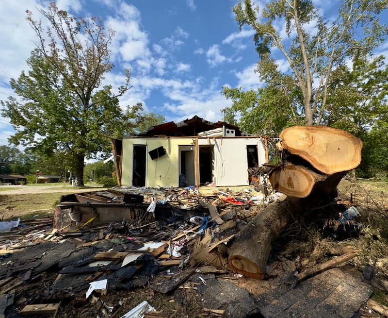 Part of the oak tree that slammed down on a Sandersville home during Hurricane Helene and killed two children, Harmony Taylor, 7, and her brother Derrick, 4. (Joe Kovac Jr. / AJC)