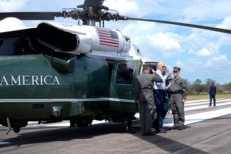 President Joe Biden walks off Marine One, after flying around areas impacted by Hurricane Helene near Perry, Fla., Thursday, Oct. 3, 2024. (AP Photo/Susan Walsh)