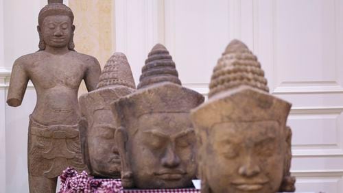 In this photo released by Agence Kampuchea Press (AKP), artifact statues are displayed during a ceremony for the return of artifacts at Peace Palace in Phnom Penh, Cambodia, Thursday, Aug. 22, 2024. (AKP via AP)