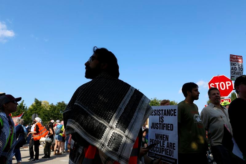 YM Masood, 20, attends the March on DNC protest on Monday, Aug. 19, 2024, in Chicago. (AP Photo/Martha Irvine)