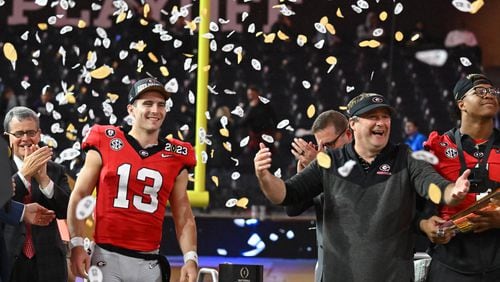 Georgia's quarterback Stetson Bennett (13) and head coach Kirby Smart celebrate their victory during the 2023 College Football Playoff National Championship game at SoFi Stadium, Monday, Jan. 9, 2023, in Inglewood, California. (Hyosub Shin / Hyosub.Shin@ajc.com)