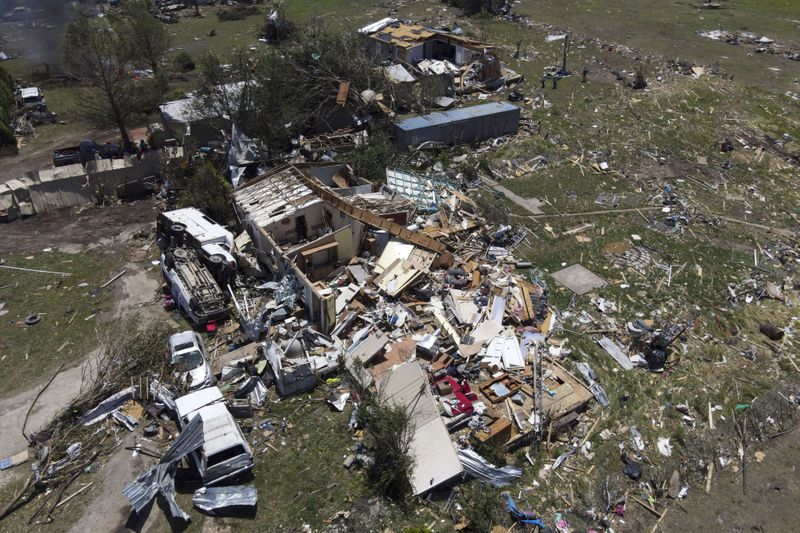 Destroyed homes are seen after a deadly tornado rolled through the previous night, Sunday, May 26, 2024, in Valley View, Texas. Powerful storms left a wide trail of destruction Sunday across Texas, Oklahoma and Arkansas after obliterating homes and destroying a truck stop where drivers took shelter during the latest deadly weather to strike the central U.S. (AP Photo/Julio Cortez)