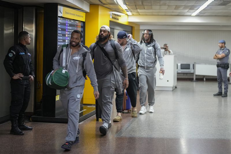 Philadelphia Eagles players arrive at Sao Paulo International airport ahead of a game against the Philadelphia Eagles, in Guarulhos, greater Sao Paulo, Brazil, Wednesday, Sept. 4, 2024. (AP Photo/Andre Penner)