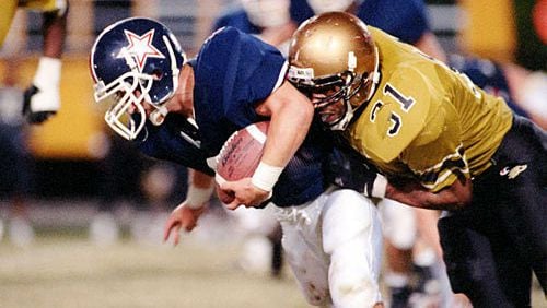 Jamal Lewis (31, right, vs. Dunwoody in 1995) gained 1,923 yards and scored 28 TDs as a junior.