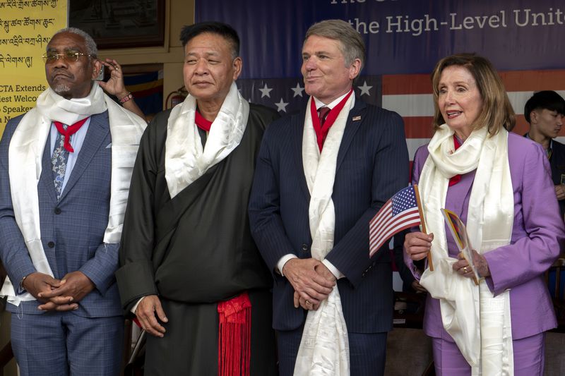 Standing from L to R, Democratic Rep. Gregory Meeks, President of the Central Tibetan Administration Penpa Tsering, Republican Rep. Michael McCaul, and Democratic former House Speaker Nancy Pelosi, stand together as they arrive to attend at a public event during which the US delegates were felicitated by the Tibetan exiled government officials at the Tsuglakhang temple in Dharamshala, India, Wednesday, June 19, 2024. (AP Photo/Ashwini Bhatia)