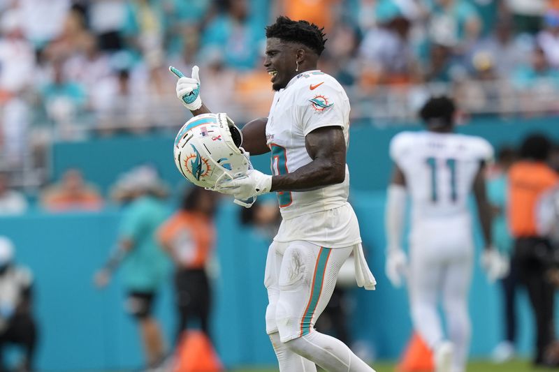 Miami Dolphins wide receiver Tyreek Hill (10) gestures during the second half of an NFL football game against the Jacksonville Jaguars, Sunday, Sept. 8, 2024, in Miami Gardens, Fla. The Dolphins defeated the Jaguars 20-17. (AP Photo/Rebecca Blackwell)