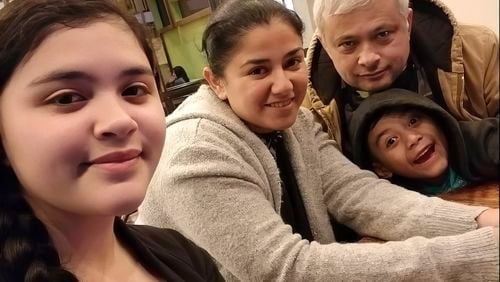 In this July 2020 photo, Xavier Chavarría, background right, poses for a photo with his wife Karen Chavarría, second left, and their children Karen Azriela Chavarria, left, and son Xavier Yahir Chavarría, in Jinotega, Nicaragua. (Courtesy Xavier Chavarría via AP)