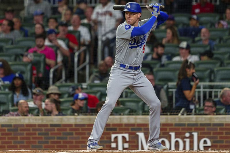 Los Angeles Dodgers' Freddie Freeman watches the pitch in the third inning of a baseball game against the Atlanta Braves, Saturday, Sept. 14, 2024, in Atlanta. (AP Photo/Jason Allen)