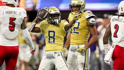 Georgia Tech wide receiver Malik Rutherford (8) celebrates a first down after a 14-yard catch with wide receiver Dominick Blaylock (12) during the fourth quarter against Louisville in the Aflac Kickoff Game at Mercedes-Benz Stadium, Friday, September 1, 2023, in Atlanta. Georgia Tech lost to Louisville 39-34. (Jason Getz / Jason.Getz@ajc.com)