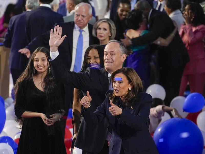 Democratic presidential nominee Vice President Kamala Harris and First Gentalman Doug Emhoff during the Democratic National Convention Thursday, Aug. 22, 2024, in Chicago. (AP Photo/Charles Rex Arbogast)