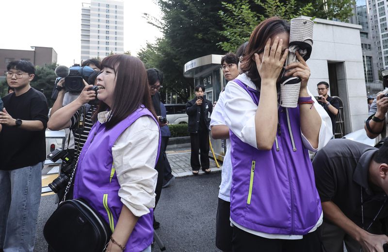 Bereaved family members of the victims of the Halloween crush in 2022 react at the Seoul Western District Court in Seoul, South Korea, Monday, Sept. 30, 2024. (Kim Geun-soo/Newsis via AP)