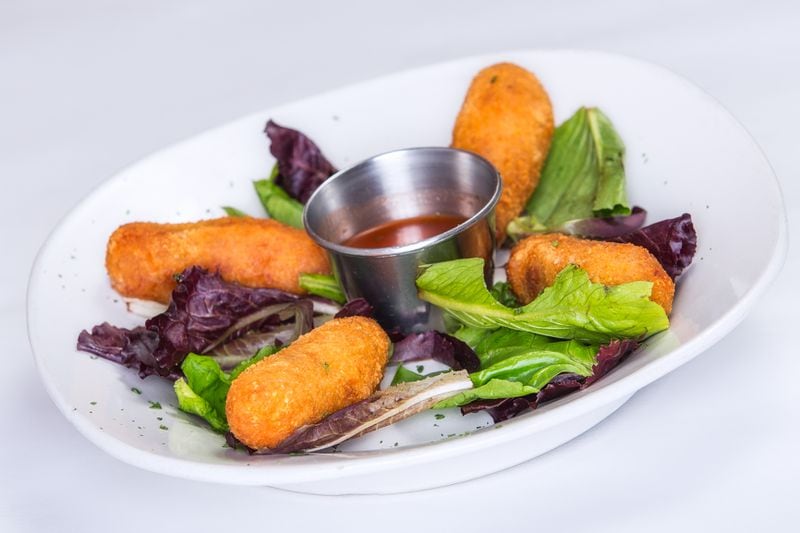 The menu at Mojito's Cuban-American Bistro includes Cuban classics like the ham croquettes pictured here. / Mojito's Cuban-American Bistro