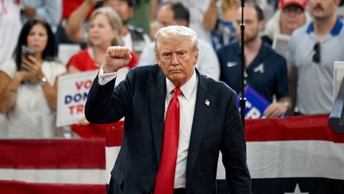 Former President Donald Trump prepares to leave the stage during a campaign rally at Georgia State University’s convocation center on Saturday evening, Aug. 3, 2024, in Atlanta. (Hyosub Shin / AJC)