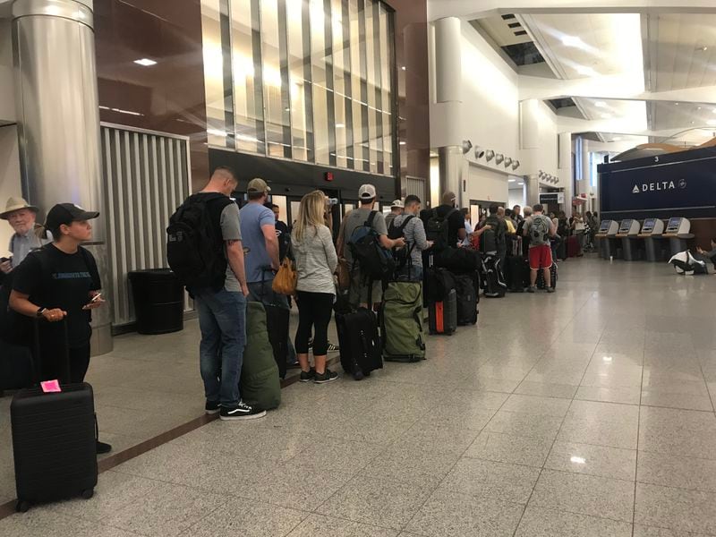 Long lines make it clear that Memorial Day weekend travel is in full swing at Hartsfield-Jackson International Airport on Friday morning, May 24, 2019 (Photo: Kelly Yamanouchi/AJC)