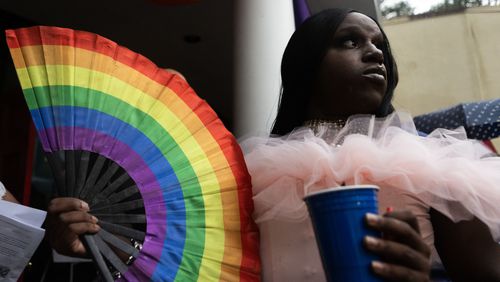 Cleopatra Rose waves a rainbow fan after the Drag Me to Church event at St. Luke Lutheran on Sunday, 25, 2023 in Atlanta. (Michael Blackshire/Michael.blackshire@ajc.com)