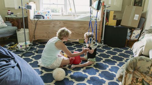 Mary Reed, pictured with her medically fragile daughter, is a board member of Atlanta Life House, a nonprofit working to build a facility to support other caregiving parents. Courtesy of Sarah Eaves