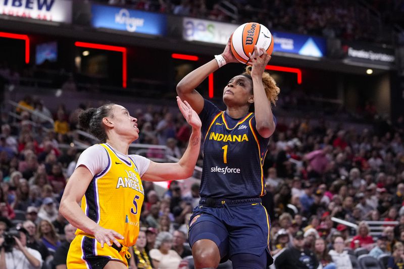 Indiana Fever forward NaLyssa Smith (1) shoots over Los Angeles Sparks forward Dearica Hamby (5) in the second half of a WNBA basketball game in Indianapolis, Wednesday, Sept. 4, 2024. (AP Photo/Michael Conroy)