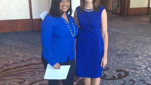 Nikema Williams, left, and state Rep. Stacey Evans, right, on the sidelines of Mike Pence's Cobb County rally on Aug. 29, 2016. GREG BLUESTEIN/AJC