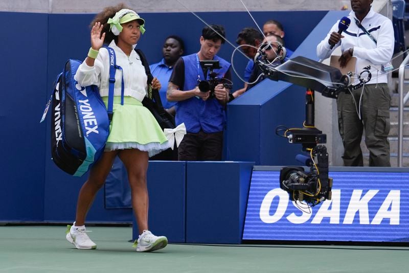 Naomi Osaka, of Japan, walks on the court before playing against Jelena Ostapenko, of Latvia, during the first round of the U.S. Open tennis championships, Tuesday, Aug. 27, 2024, in New York. (AP Photo/Seth Wenig)