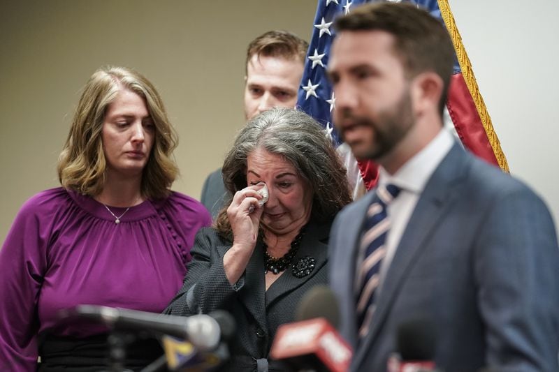 Virginia Baker, mother of slain UGA law student Tara Louise Baker wipes tears from her eyes as  Georgia state Rep. Houston Gaines, R-Athens, speaks during a press conference announcing an arrest in the 23-year-old cold case death on Monday, May 13, 2024, in Decatur. (Elijah Nouvelage for The Atlanta Journal-Constitution)