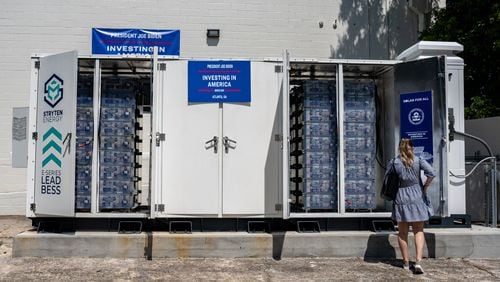 The Stryten Energy battery bank sits behind the community center. Atlanta Mayor Andre Dickens is joined Representative Nikema Williams and EPA administrator Michael Regan at the Vicars Community Center in West Atlanta. Leaders gathered to tour and speak about new solar panels and batteries installed via a federal grant. Wednesday, July 31, 2024 (Ben Hendren for the Atlanta Journal-Constitution)