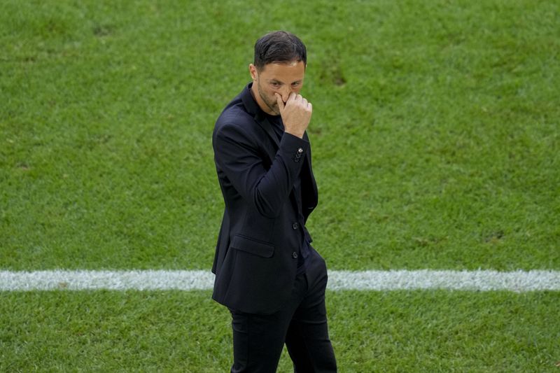 Belgium's head coach Domenico Tedesco gestures during a round of sixteen match between France and Belgium at the Euro 2024 soccer tournament in Duesseldorf, Germany, Monday, July 1, 2024. (AP Photo/Andreea Alexandru)