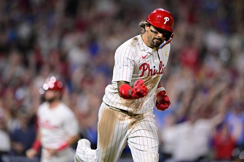 Philadelphia Phillies' Nick Castellanos reacts after hitting a walk off single against Atlanta Braves' Grant Holmes during the 11th inning of a baseball game, Sunday, Sept. 1, 2024, in Philadelphia. (AP Photo/Derik Hamilton)