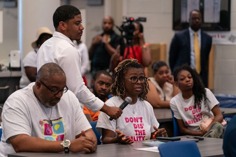 Atlanta Thrive Program Director Lindsey Davis asks Bryan Johnson, the sole finalist for Atlanta Public Schools superintendent, a question at The New Schools at Carver in Atlanta on Tuesday, June 25, 2024. (Seeger Gray/AJC)