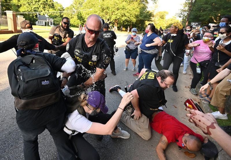 Police arrested protesters as they rallied across the street from the Governor’s Mansion in Buckhead on Saturday, May 30, 2020. It was the second day of marches and rallies in Atlanta over the recent deaths of unarmed black people in Minneapolis; Brunswick, Georgia; and Louisville, Kentucky, at the hands of police officers or civilians acting as law enforcers. (Hyosub Shin / Hyosub.Shin@ajc.com)