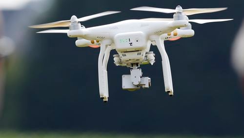 FILE - A DJI Phantom 3 drone flies during a drone demonstration at a farm and winery, on June 11, 2015 in Cordova, Md. China says it will prohibit the export of all unregulated civilian drones that could be used for military purposes or in terrorist activities and that certain drone features will be restricted as the East Asian country faces repeated Western criticism for its stance on the Russian invasion of Ukraine. (AP Photo/Alex Brandon, File)