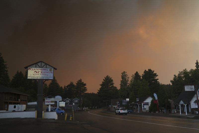 FILE - Smoke from the Line Fire fills the air Saturday, Sept. 7, 2024, in Running Springs, Calif. (AP Photo/Eric Thayer, File)