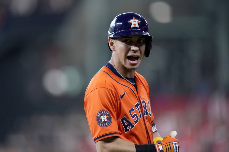 Houston Astros' Mauricio Dubon celebrates his bunt for a single against the Detroit Tigers in the seventh inning of Game 2 of an AL Wild Card Series baseball game Wednesday, Oct. 2, 2024, in Houston. (AP Photo/Kevin M. Cox)