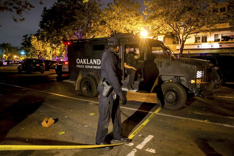 Oakland police officers respond to a multiple shooting during a Juneteenth celebration near Lake Merritt in Oakland, Calif., on Wednesday, June 19, 2024. A Juneteenth celebration in Oakland, California, turned violent when several people were shot, police said. (Ray Chavez /Bay Area News Group via AP)