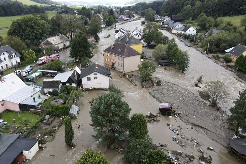 A view of flooded houses in Jesenik, Czech Republic, Sunday, Sept. 15, 2024. (AP Photo/Petr David Josek)