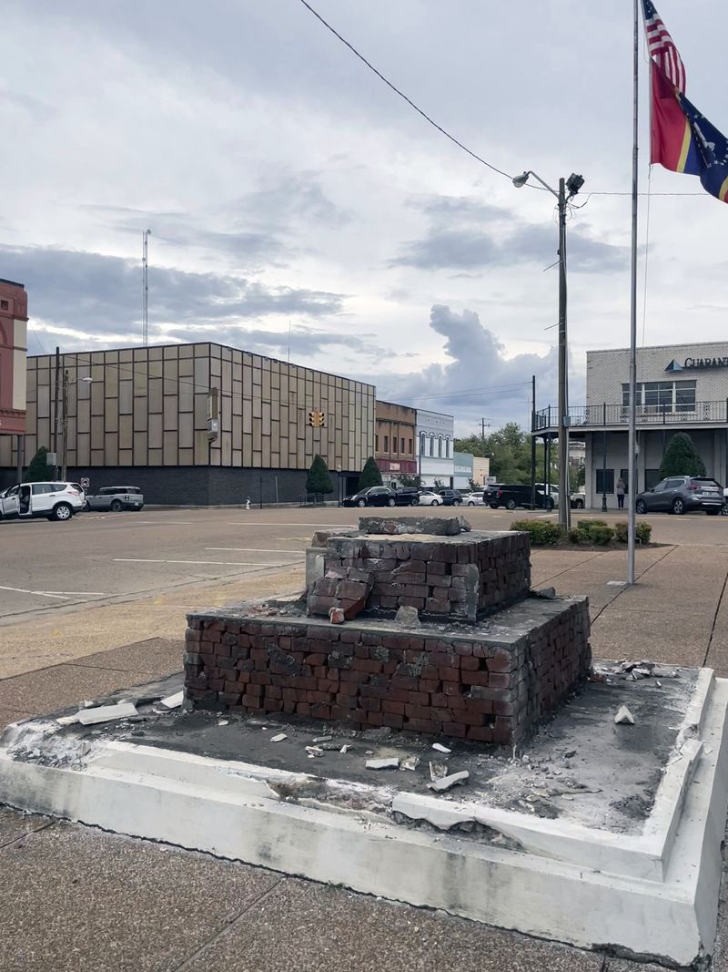 A base that had held a Confederate monument in downtown Grenada, Miss., since 1910, stands empty after a crew removed the monument, Wednesday, Sept. 11, 2024.( AP Photo/Emily Wagster Pettus)